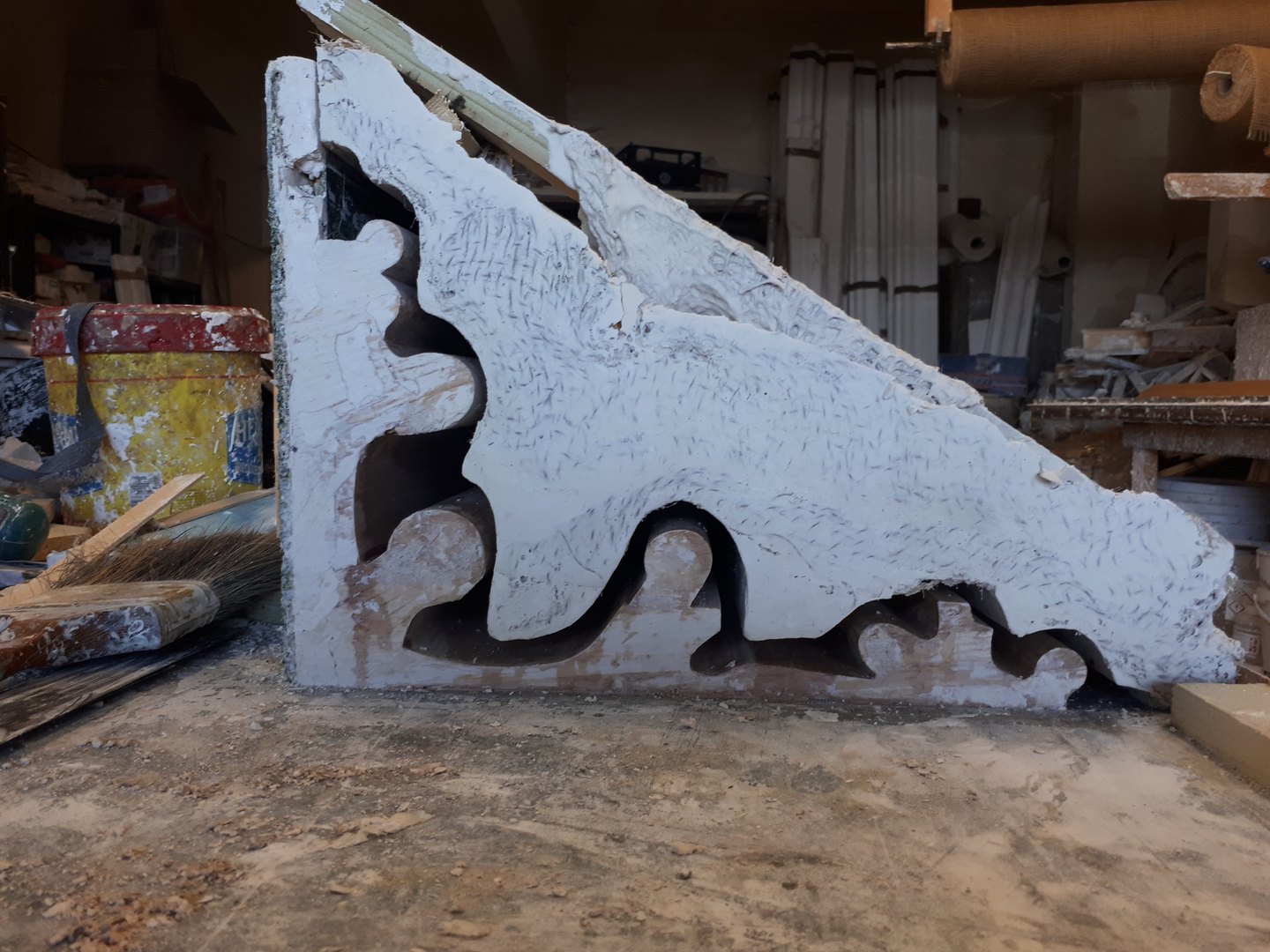 A rubber mould for a length of cornice being made in the workshop